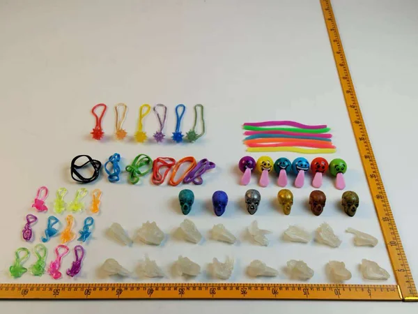 Soft-touch squishy charms and stretchy strings